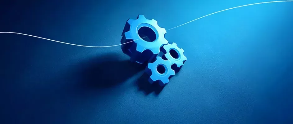 Ícono de engranajes azules, representando ingeniería, procesos y optimización